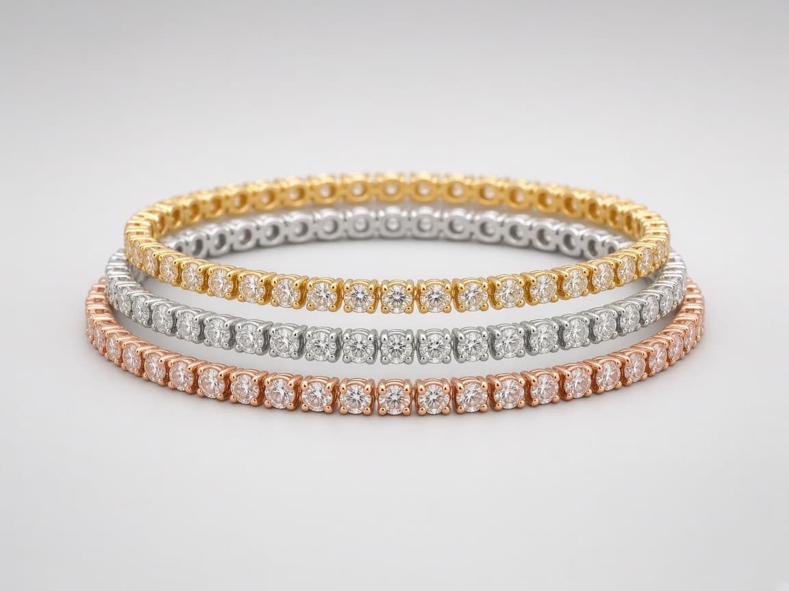 Diamond tennis bracelets in yellow gold, platinum, and rose gold